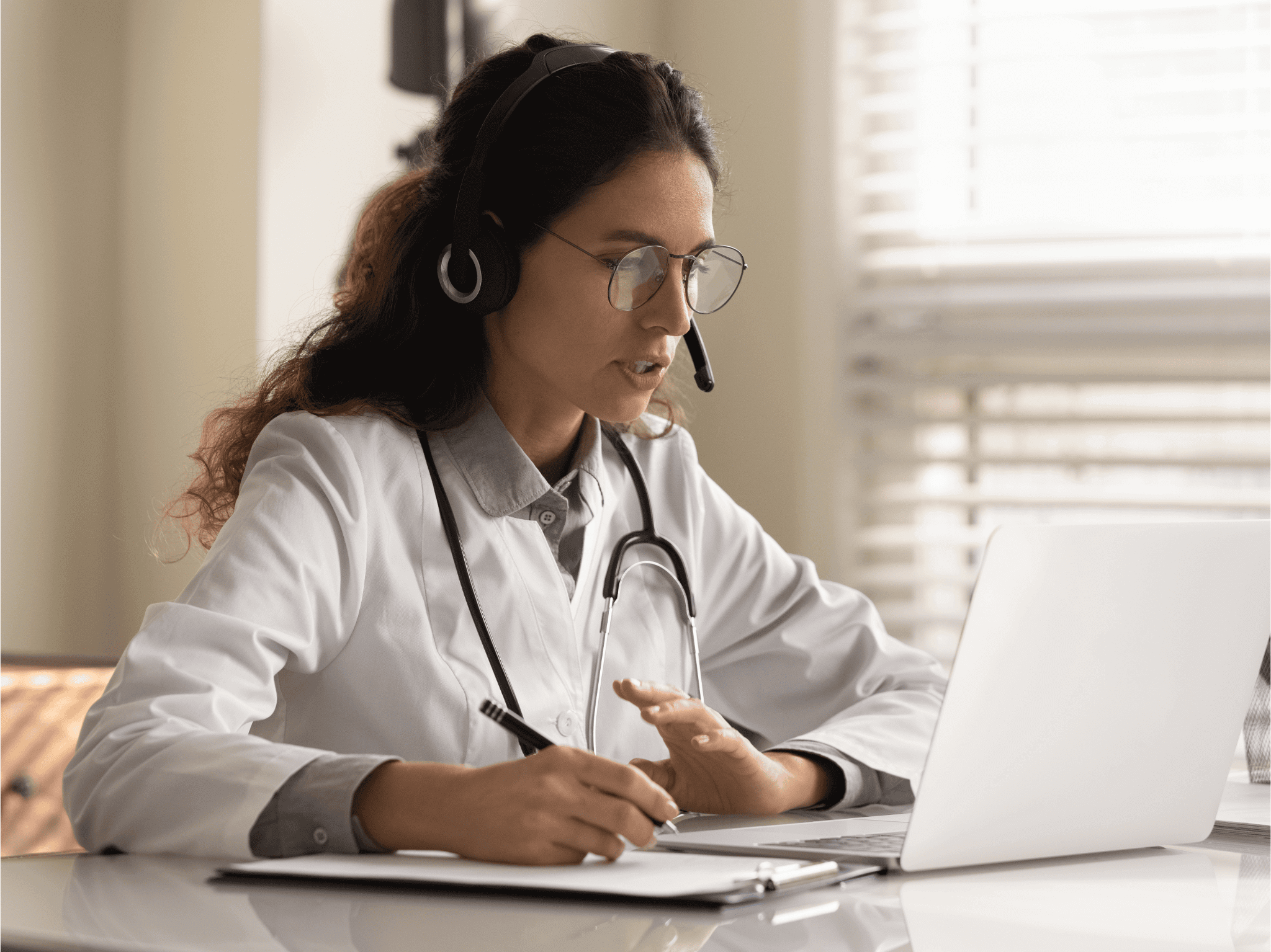 Pharmacist on virtual consultation wearing headset