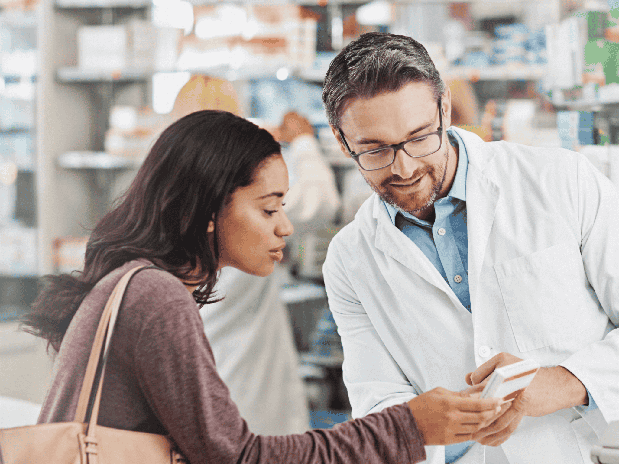 Pharmacist explaining medication to patient